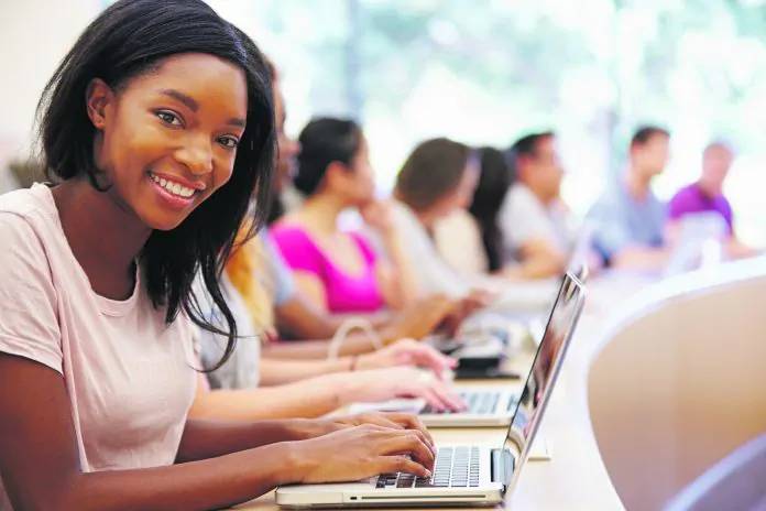 Class Of University Students Using Laptops In Lecture