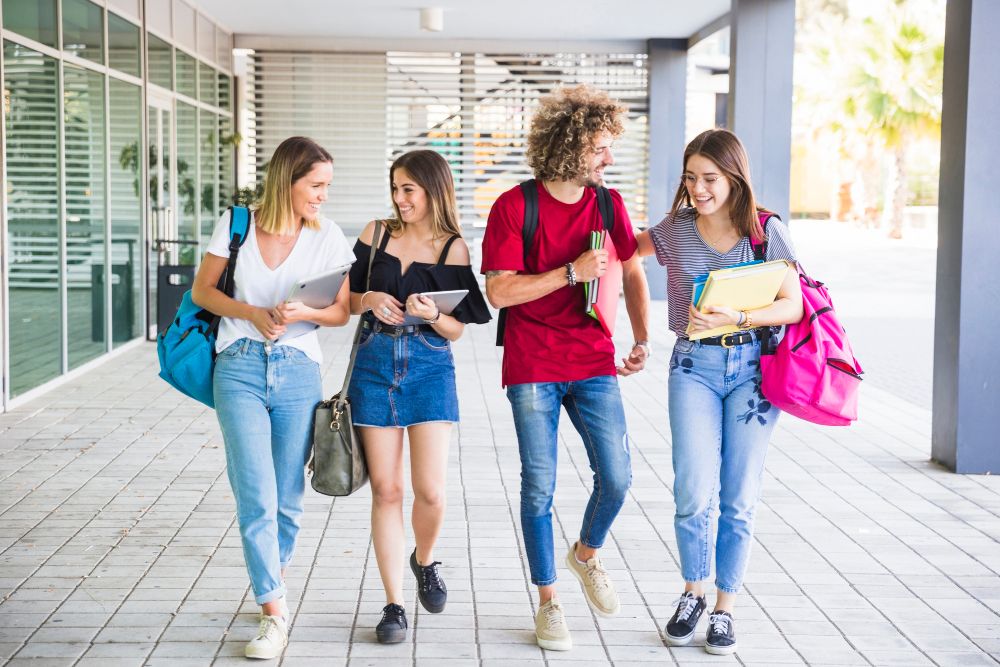 cheerful-students-communicating-after-lessons